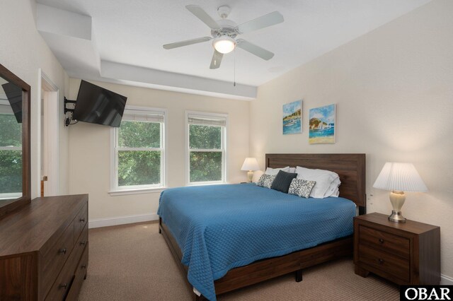 bedroom featuring light carpet, ceiling fan, and baseboards