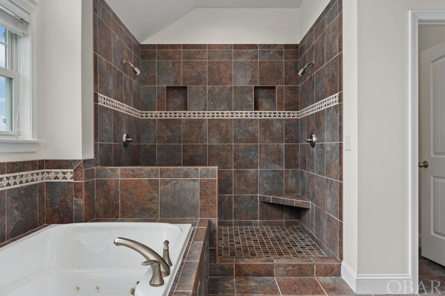 full bathroom with vaulted ceiling, a tile shower, and a jetted tub