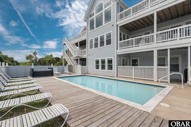 view of swimming pool featuring fence and a fenced in pool