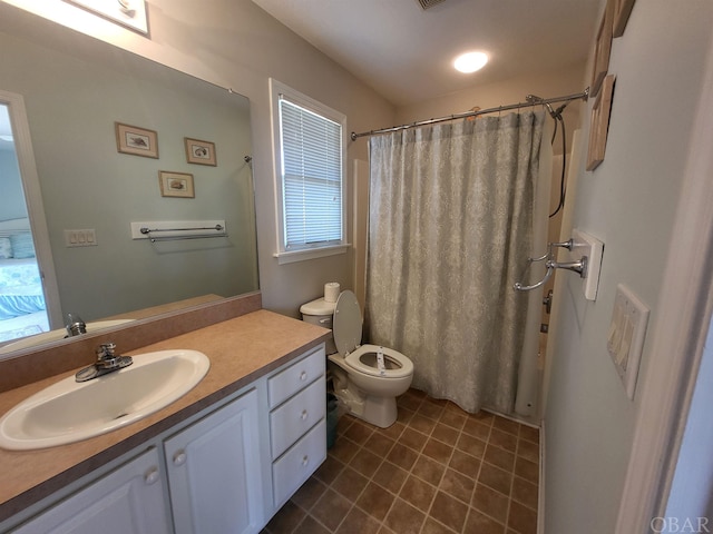 full bath with toilet, a shower with shower curtain, tile patterned flooring, and vanity