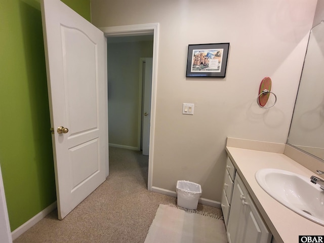 bathroom with baseboards and vanity