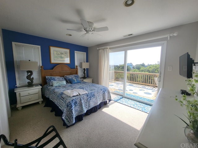 bedroom with carpet floors, access to outside, visible vents, and ceiling fan