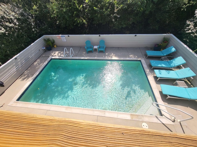 outdoor pool with a patio