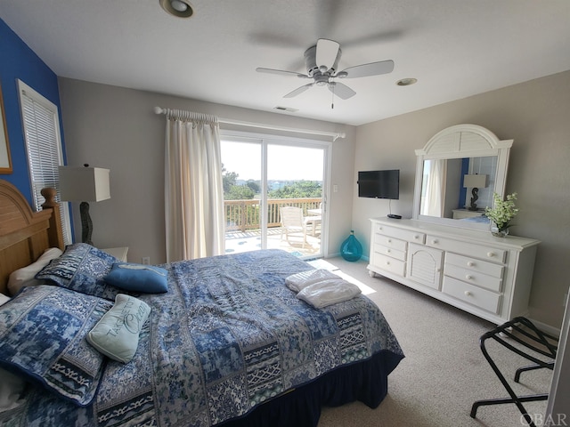 bedroom with carpet floors, access to outside, visible vents, and ceiling fan