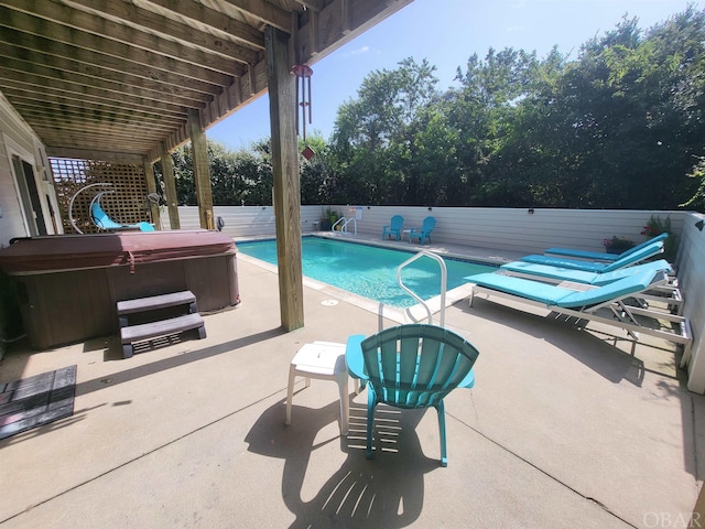 view of pool with a fenced in pool, a patio area, a hot tub, and a fenced backyard