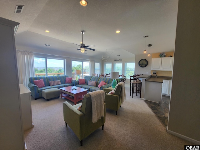 living room featuring visible vents, recessed lighting, vaulted ceiling, ceiling fan, and carpet flooring