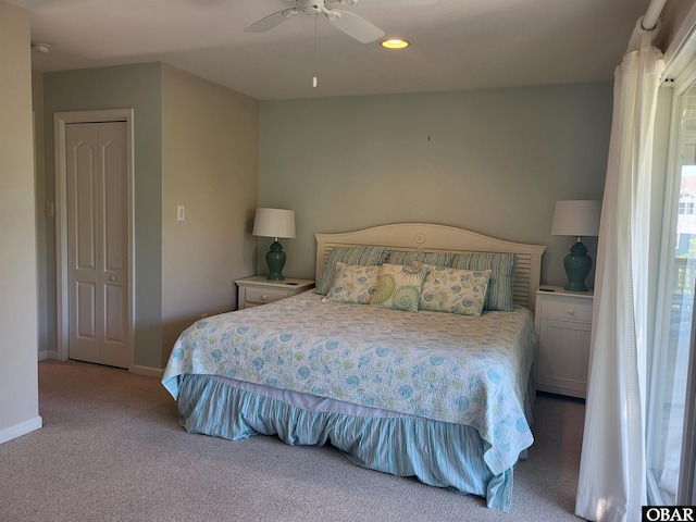 bedroom featuring baseboards, a ceiling fan, and carpet floors