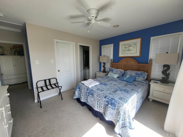 bedroom with ceiling fan, carpet floors, and baseboards