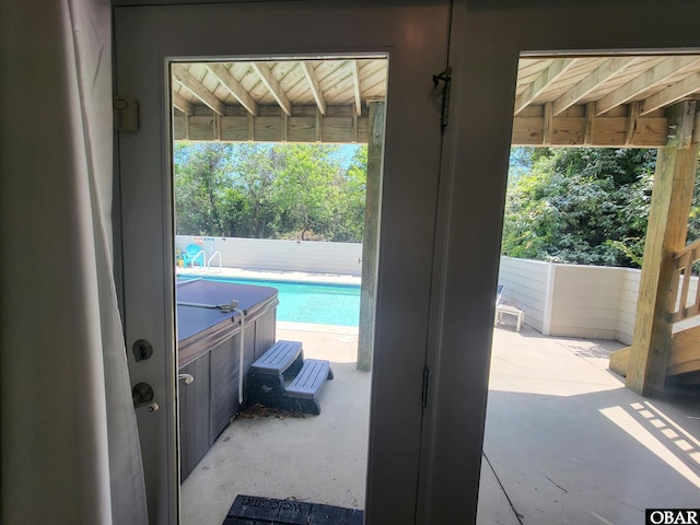 doorway to outside featuring concrete flooring