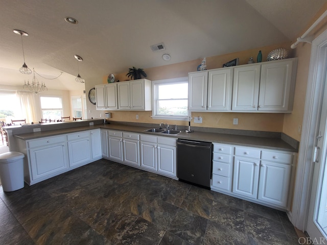 kitchen featuring visible vents, white cabinets, vaulted ceiling, hanging light fixtures, and dishwasher