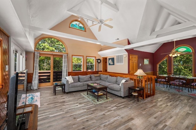 living room featuring high vaulted ceiling, ceiling fan, and wood finished floors