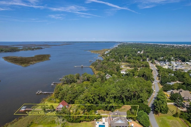 drone / aerial view with a water view and a residential view