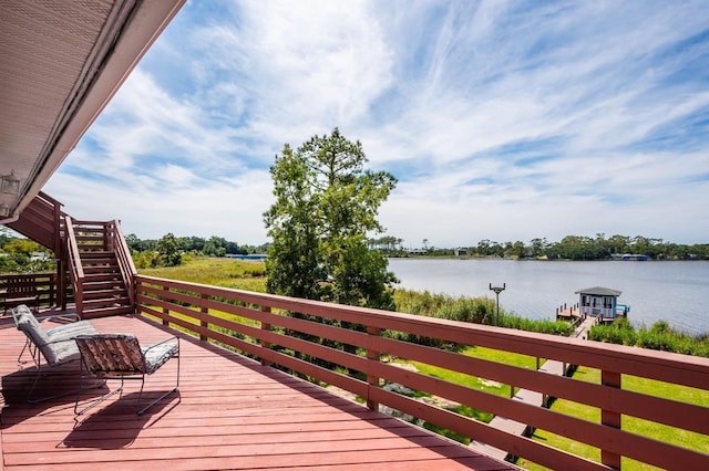 deck featuring a water view