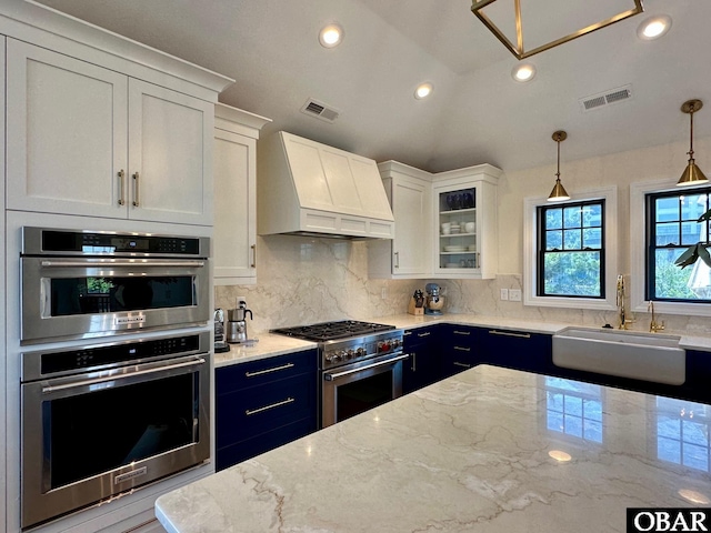 126 Buffell Head Rd Lot 146, Duck, NC 27949 - kitchen featuring custom range hood, appliances with stainless steel finishes, a sink, white cabinetry, and tasteful backsplash