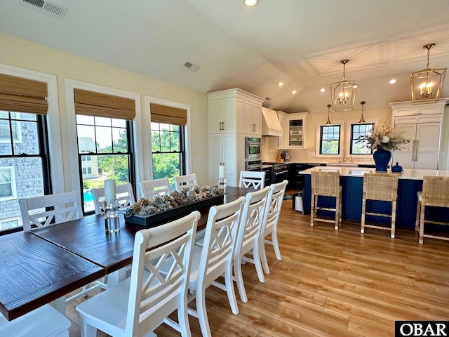 126 Buffell Head Rd Lot 146, Duck, NC 27949 - dining space with vaulted ceiling, light wood-type flooring, a chandelier, and recessed lighting