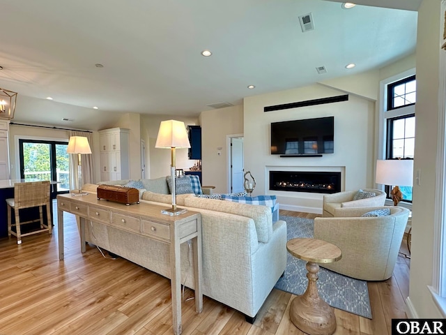 126 Buffell Head Rd Lot 146, Duck, NC 27949 - living area featuring a lit fireplace, light wood finished floors, healthy amount of natural light, and recessed lighting