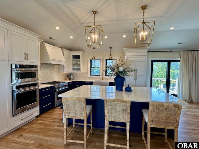 126 Buffell Head Rd Lot 146, Duck, NC 27949 - kitchen featuring stainless steel appliances, custom range hood, a chandelier, a sink, and recessed lighting