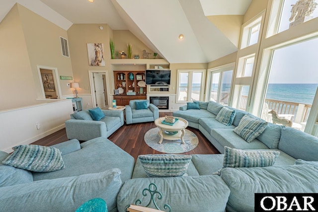 22097 Sea Gull St Lot 7, Rodanthe, NC 27968 - living room with high vaulted ceiling, plenty of natural light, dark wood-type flooring, baseboards, and recessed lighting