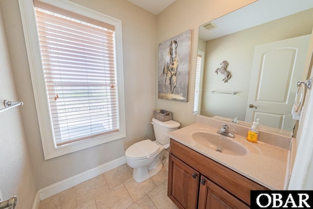 22097 Sea Gull St Lot 7, Rodanthe, NC 27968 - half bath with toilet, vanity, healthy amount of natural light, and baseboards