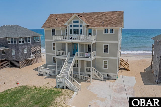 22097 Sea Gull St Lot 7, Rodanthe, NC 27968 - back of property featuring stairs, a balcony, and view of water and beach