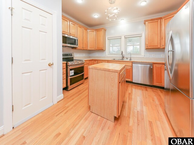 892 S Mills Rd Lot 10, Moyock, NC 27958 - kitchen with stainless steel appliances, ornamental molding, wooden counters, a sink, and light brown cabinets