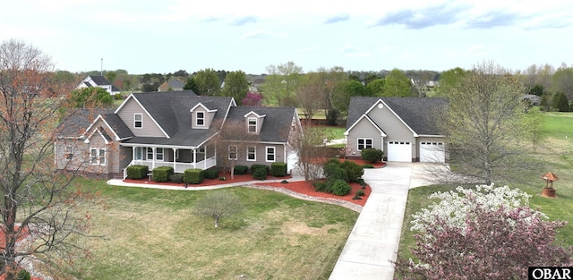 892 S Mills Rd Lot 10, Moyock, NC 27958 - view of front facade with driveway, covered porch, a garage, and a front yard