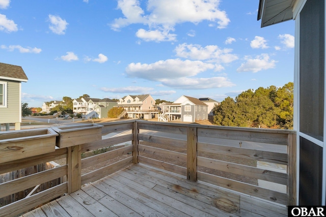 wooden terrace featuring a residential view