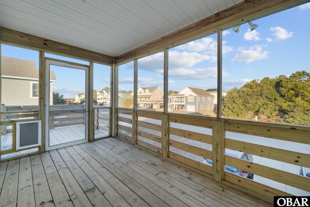 unfurnished sunroom featuring a residential view