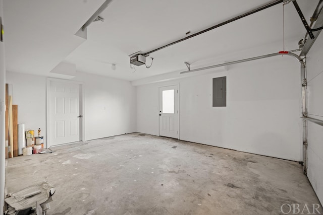 garage featuring electric panel and a garage door opener