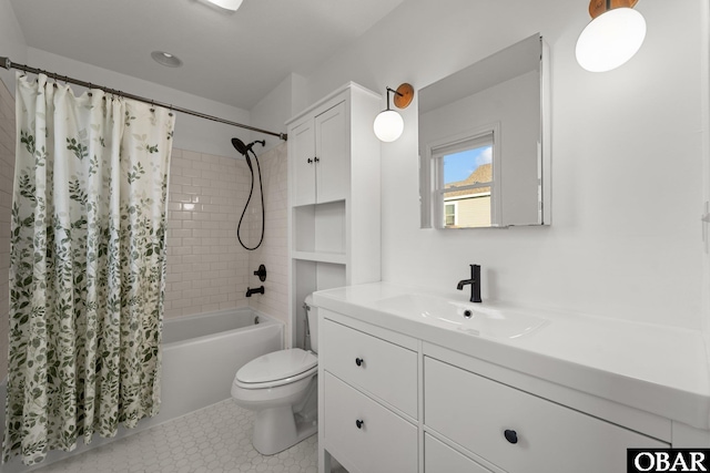 bathroom featuring vanity, toilet, and shower / bath combo with shower curtain