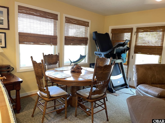 dining area featuring baseboards