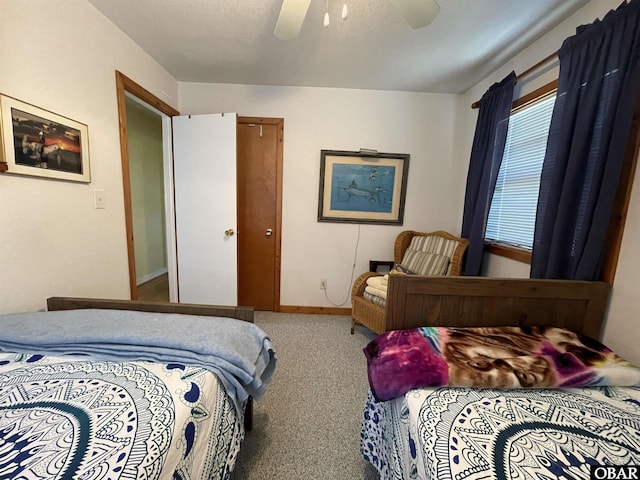 bedroom featuring carpet floors, baseboards, and a ceiling fan