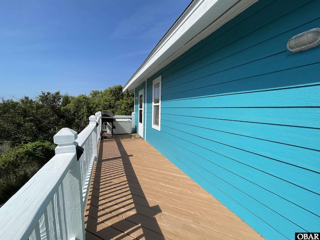 wooden deck featuring area for grilling