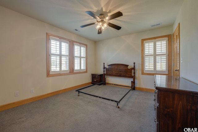 1602 Harbour View Dr Lot 119, Kill Devil Hills, NC 27948 - carpeted bedroom with multiple windows and ceiling fan