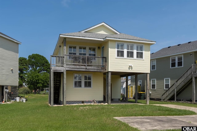1602 Harbour View Dr Lot 119, Kill Devil Hills, NC 27948 - back of house with a lawn, stairway, a balcony, and a shingled roof