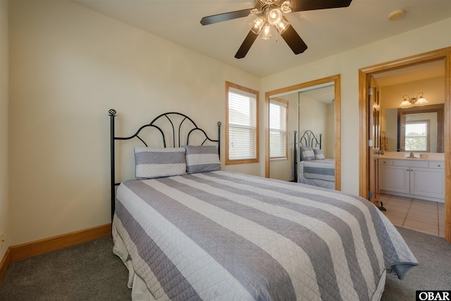 1602 Harbour View Dr Lot 119, Kill Devil Hills, NC 27948 - bedroom with light colored carpet, a closet, ceiling fan, and ensuite bathroom