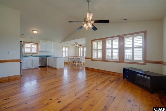 1602 Harbour View Dr Lot 119, Kill Devil Hills, NC 27948 - unfurnished living room featuring light wood-type flooring, ceiling fan, and vaulted ceiling