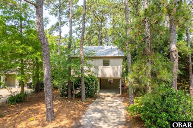 520 W Ocean Acres Dr Lot 36, Kill Devil Hills, NC 27948 - view of front of home featuring a carport, driveway, and stairs