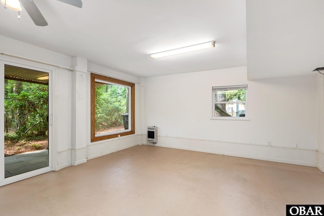 520 W Ocean Acres Dr Lot 36, Kill Devil Hills, NC 27948 - empty room with heating unit, healthy amount of natural light, and ceiling fan
