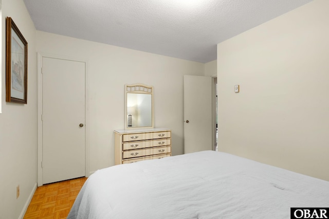 520 W Ocean Acres Dr Lot 36, Kill Devil Hills, NC 27948 - bedroom featuring baseboards and a textured ceiling