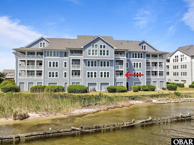view of building exterior with a water view