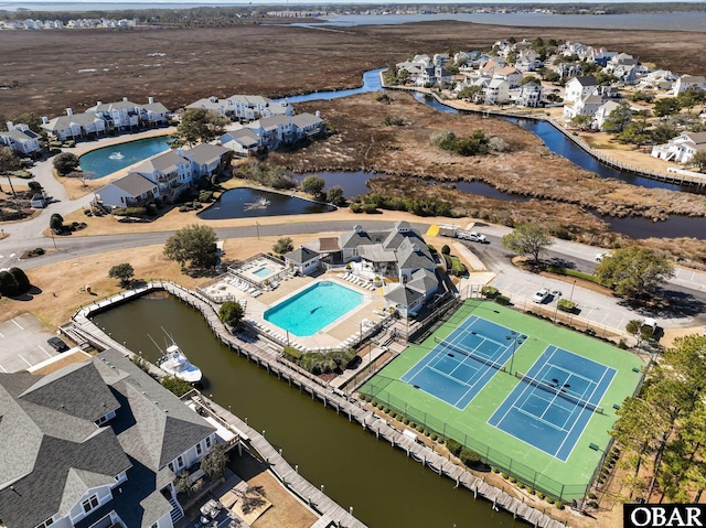 birds eye view of property featuring a water view and a residential view