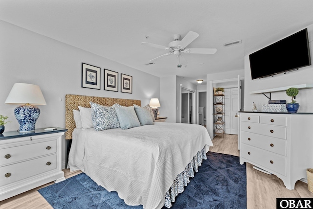 bedroom featuring visible vents, a ceiling fan, and light wood-type flooring