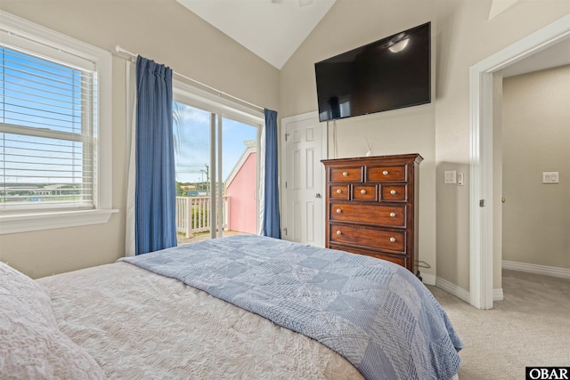 1108 Cambridge Rd Unit 307-A, Kill Devil Hills, NC 27948 - carpeted bedroom with multiple windows, access to exterior, and vaulted ceiling