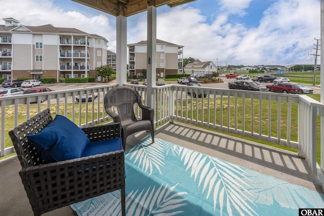1108 Cambridge Rd Unit 307-A, Kill Devil Hills, NC 27948 - wooden porch with a lawn