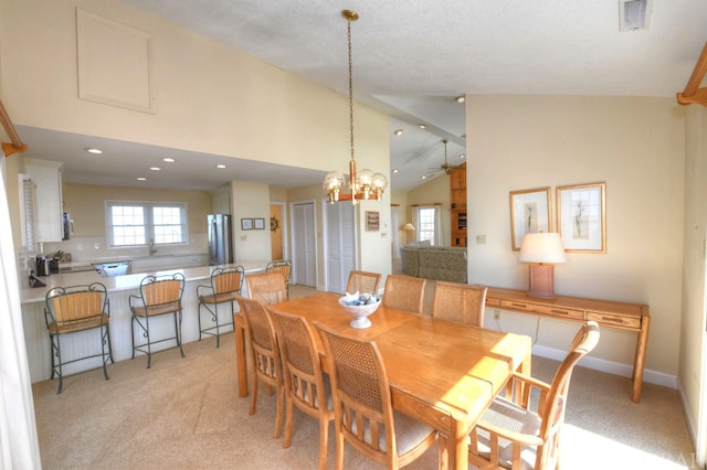 dining space with a chandelier, recessed lighting, light colored carpet, visible vents, and baseboards