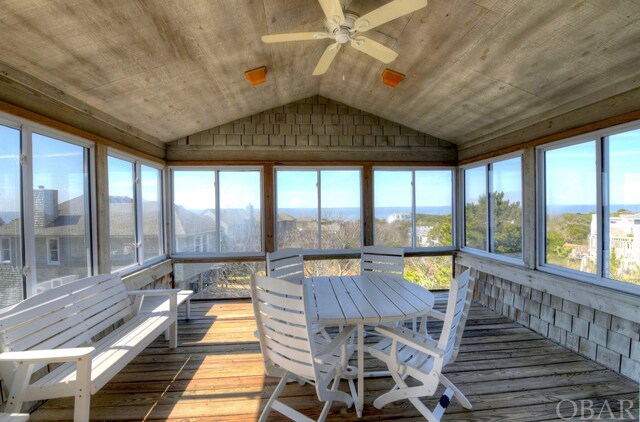 sunroom / solarium featuring ceiling fan, wood ceiling, and vaulted ceiling