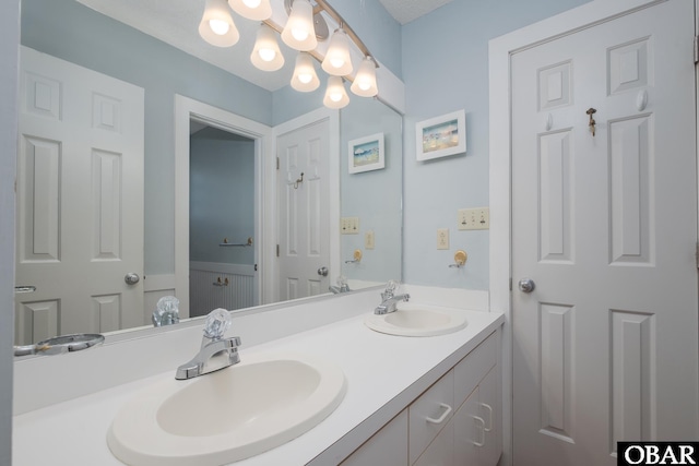 bathroom with double vanity and a sink