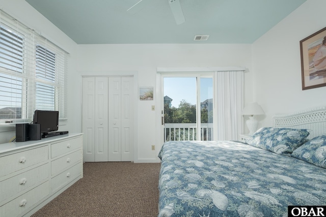 bedroom with a closet, ceiling fan, access to outside, visible vents, and dark colored carpet
