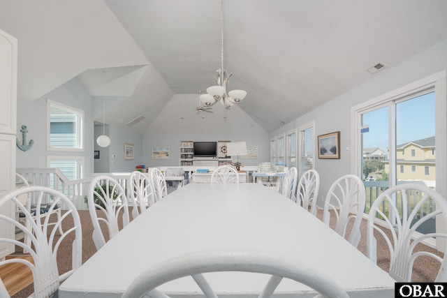 dining space featuring a chandelier, plenty of natural light, visible vents, and vaulted ceiling